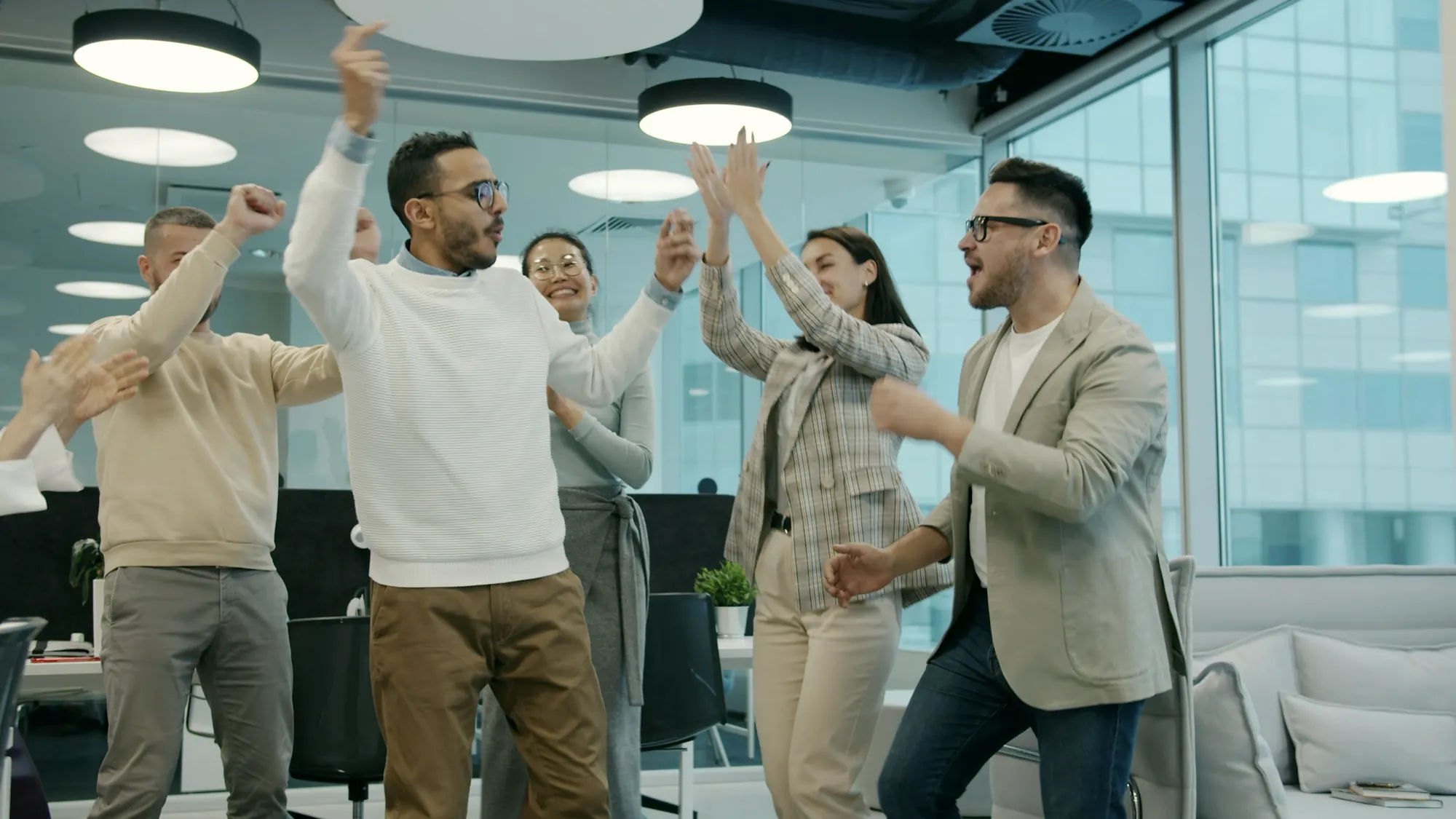 Colleagues celebrating together in an office